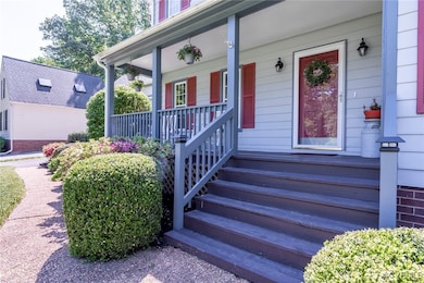 Doorway to property featuring a porch