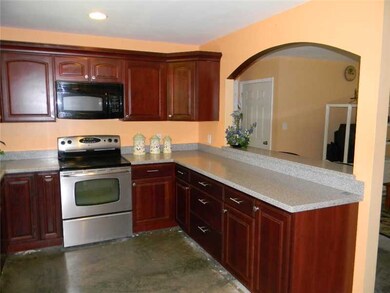 Kitchen. Cherry cabinets with Corian Countertops