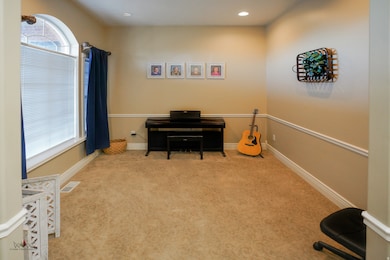Miscellaneous room featuring light colored carpet and recessed lighting