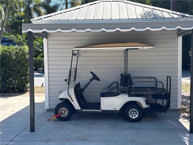 View of vehicle parking with a carport