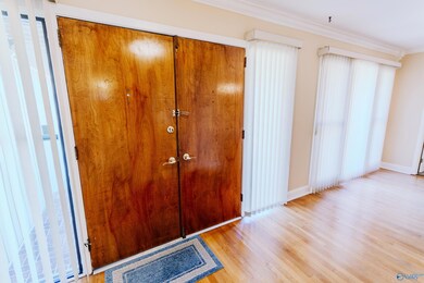 BEAUTIFUL HARDWOOD FLOORING IN 11X6 FOYER, DINING ROOM AND LIVING ROOM UNDER CARPET.