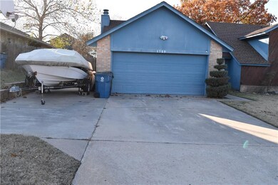 front exterior with wide driveway