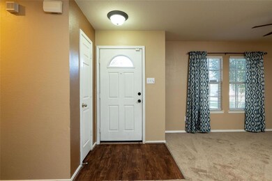 Facing front door entry with dining to the right.