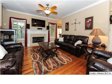 Living room opens to the kitchen and formal dining