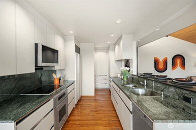 Treat the chef to high-end built-in appliances & sleek, Euro-inspired cabinetry.