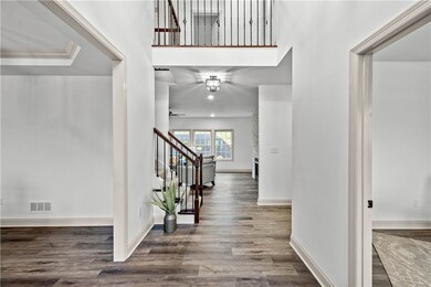 Spacious entryway leads to study, dining room, fam