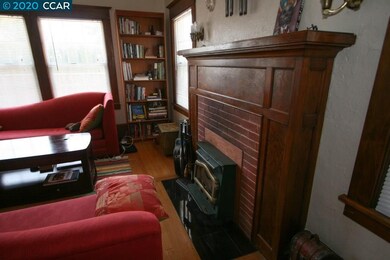 Closer shot of fireplace w/ insert and the firepla