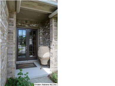 Covered porch welcomes your guests.