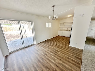 Unfurnished dining area featuring a chandelier, a