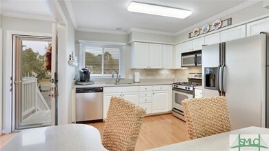 The kitchen features stainless steel appliances, i
