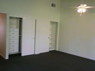 Master bedroom has closet organizers and a ceiling