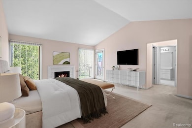 Bedroom featuring carpet floors, access to master bath, vaulted ceiling, a gas fireplace, and access to outside balcony