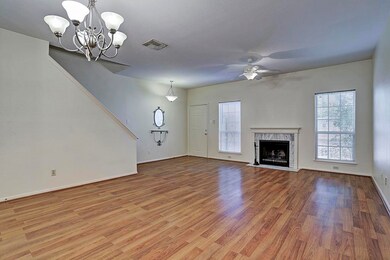 View of the front door and wood burning fireplace.