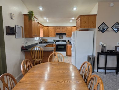 Dining area featuring baseboards and recessed lighting
