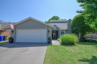 View of front of property with a front yard and a 