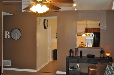Living Room View to Hallway and Kitchen
