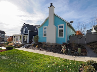 Bungalow-style house featuring a chimney and a porch