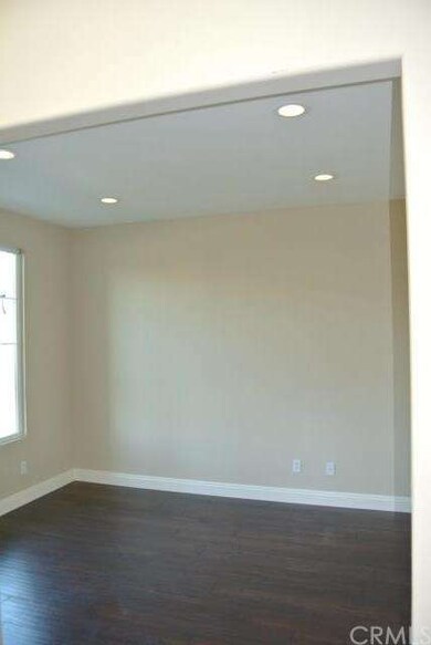 Office/library with dark wood floors