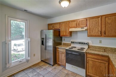 Kitchen has tile floor and granite counter tops