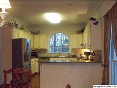 Kitchen has stainless appliances and amazing grani