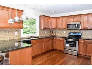Remodeled kitchen with new granite countertops and