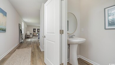 Bathroom featuring hardwood / wood-style floors and sink