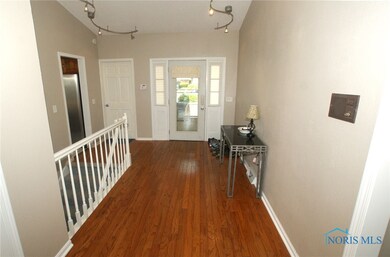 Hardwood foyer & custom lighting