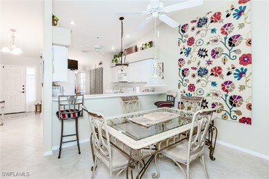 Dining space with light tile patterned floors, bas