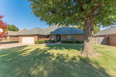 Single story home featuring brick siding, a shingled roof, driveway, and a garage