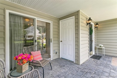 Property entrance with covered porch