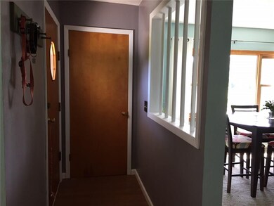 The foyer has an entry closet and views of the din