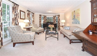 Formal living room with lots of natural light