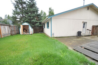 Back yard fenced with shed