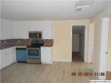 Kitchen updated with new appliances and paint.