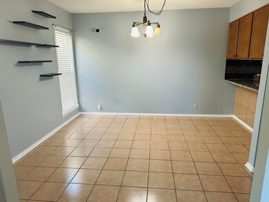 Unfurnished dining area with a notable chandelier 