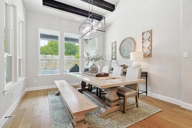 Dining room with beamed ceiling, a chandelier, and