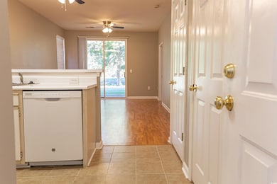 Kitchen with a sink, dishwasher, ceiling fan, ligh