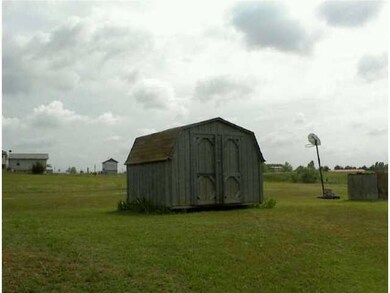 Other. View of storage building and land