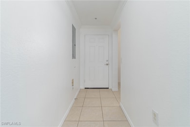 Hall featuring electric panel, baseboards, ornamen