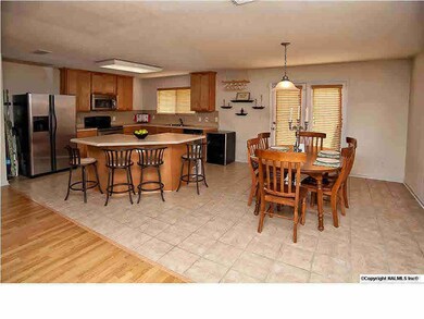 The kitchen & dining room have tile flooring,