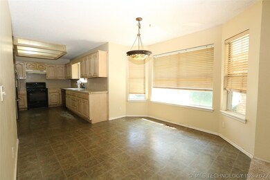 Kitchen nook with bay window looking to kitchen