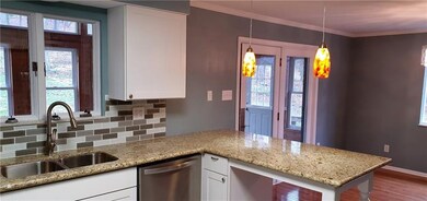 New white cabinets, sink, pendant lights, granite 