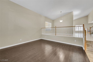 lofted ceiling and wood like finished floors