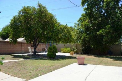 Private and secure backyard with block wall. 