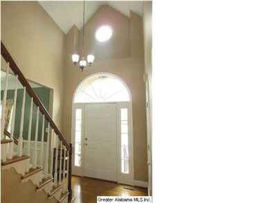 Foyer with Raised Ceiling & Hardwoods