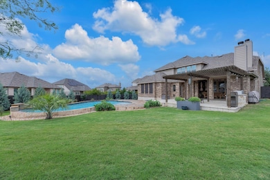 Back of house with a yard, a patio, a pergola, a 