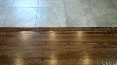 Finished Hardwood floors to Kitchen tile