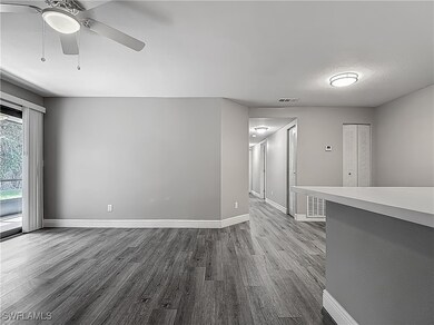Spare room featuring visible vents, baseboards, a