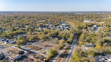 Aerial overview of property's location with nearby suburban area