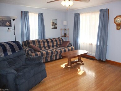 Spacious living room with hardwood floor.